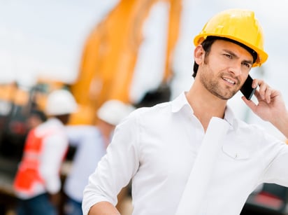 Engineer talking on the phone on a construction site 