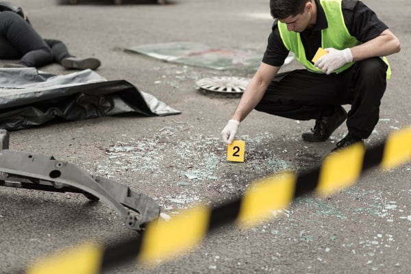 Policeman during investigation at road accident area