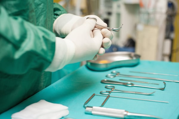 Surgeon choosing a surgical instrument in an operating room