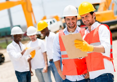 Team of architects working at a construction site 